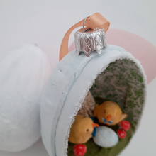 Load image into Gallery viewer, A close-up of a silver ornament topper on a spun cotton chicks diorama. Pic 5 of 7. 
