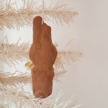 Load image into Gallery viewer, The back view of a brown, spun cotton bunny ornament, hanging on a white background. 
