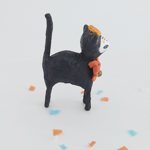 Another side view of a vintage style spun cotton Day of the Dead black cat, against a white background. Pic 8 of 9. 