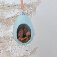 Load image into Gallery viewer, A vintage style spun cotton Easter bunny diorama ornament hanging on a white tree. Pic 5 of 8. 
