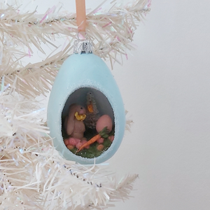 A vintage style spun cotton Easter bunny diorama ornament hanging on a white tree. Pic 5 of 8. 