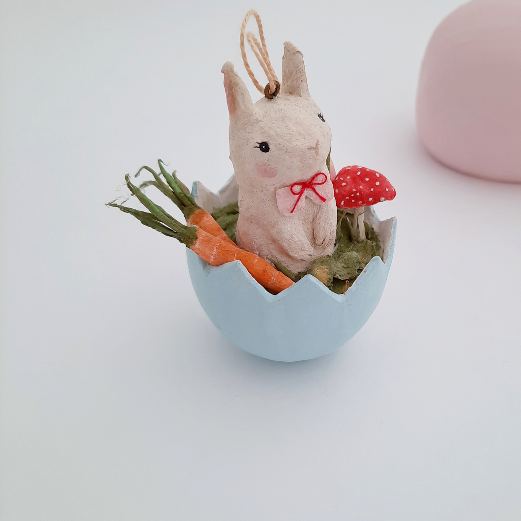 A close view of  a vintage style, spun cotton Easter bunny ornament against a white background. Pic 1 of 8. 