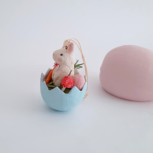 A side view of a vintage style, spun cotton Easter bunny ornament. Pic 5 of 8. 
