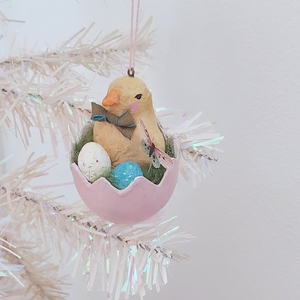 A vintage style spun cotton Easter chick ornament hanging on a white tree. Pic 3 of 7. 