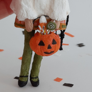 A close-up of a spun cotton jack-o-lantern bucket. Pic 4 of 8. 