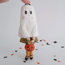 Load image into Gallery viewer, A vintage style, spun cotton ghost girl standing on Halloween confetti against a white background. Pic 1 of 7
