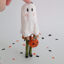 Cargar imagen en el visor de la galería, A vintage style, spun cotton ghost girl ornament standing on Halloween confetti against a white background. Pic 1 of 8
