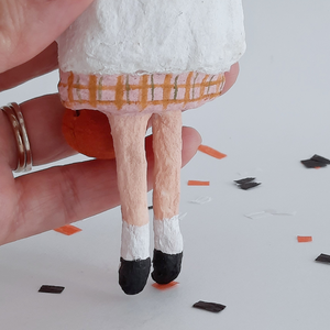 A close-up of the skirt on a vintage style, spun cotton ghost girl against a white background. Pic 5 of 8. 