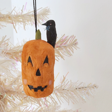 Load image into Gallery viewer, A vintage style spun cotton jack-o-lantern with crow, hanging from a tree against a white background. Pic 3 of 8. 
