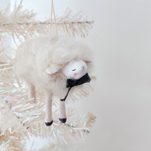Load image into Gallery viewer, A white, spun cotton needle felted sheep ornament hanging from a white tree. Pic 2 of 6. 
