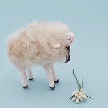 Load image into Gallery viewer, Side view of a vintage style spun cotton needle felted sheep ornament, against a light blue background. Pic 4 of 6. 
