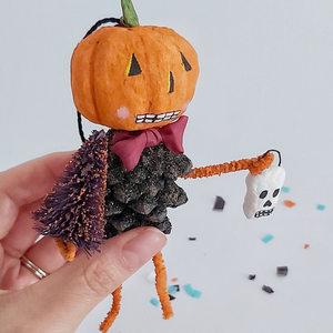 A close up of a vintage style spun cotton pinecone pumpkin man, against a white background. Pic 4 of 8. 