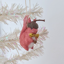 Cargar imagen en el visor de la galería, A vintage style spun cotton red squirrel ornament, hanging on a white tree against a white background. Pic 2 of 9. 
