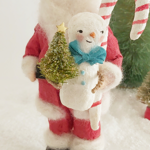 A close-up photo of a spun cotton snowman held by a spun cotton Santa. Pic 4 of 9. 