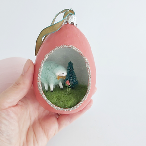 A vintage style spun cotton sheep diorama ornament held in hand against a white background. Pic 4 of 6. 