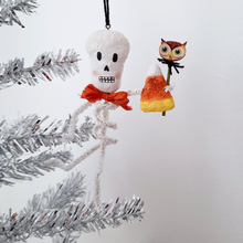 Load image into Gallery viewer, A vintage style, spun cotton pipe cleaner skeleton hanging on a silver tree. Pic 4 of 4. 
