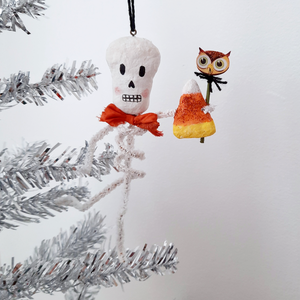 A vintage style, spun cotton pipe cleaner skeleton hanging on a silver tree. Pic 4 of 4. 