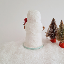 Load image into Gallery viewer, A back view of a vintage style, spun cotton snowman sitting next to two vintage bottlebrush trees. Pic 3 of 6.
