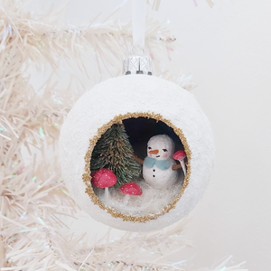 A vintage style spun cotton snowman diorama ornament hanging on a white Christmas tree. Pic 2 of 6. 
