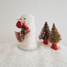 Cargar imagen en el visor de la galería, A side view of a vintage style, spun cotton snowman. Two vintage bottlebrush trees sit behind him. Pic 2 of 6.
