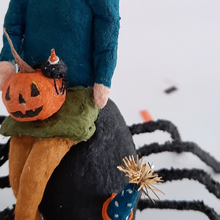 Load image into Gallery viewer, A close-up of the vintage style, spun cotton jack-o-lantern and spider sitting on a spun cotton girl&#39;s lap. Pic 6 of 10. 
