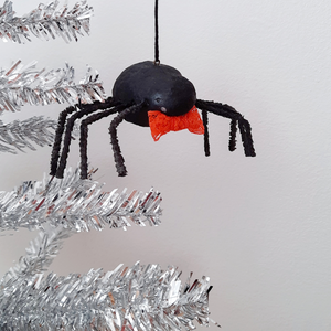 A vintage style, spun cotton spider ornament hanging on a silver tree. Pic 5 of 8. 