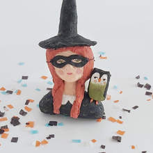 Cargar imagen en el visor de la galería, A closer view of a vintage style spun cotton witch girl ornament, sitting on Halloween confetti on a white background. Pic 3 of 9. 
