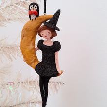 Load image into Gallery viewer, A vintage style, spun cotton witch on a moon ornament hanging on a tree.Pic 1 of 8. 
