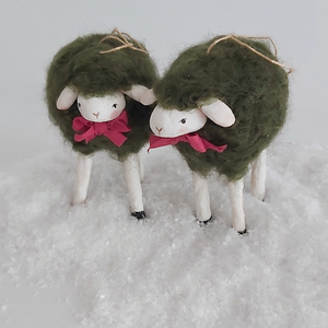 A close-up of two vintage style woolly, spun cotton green sheep ornaments. Pic 4 of 7. 