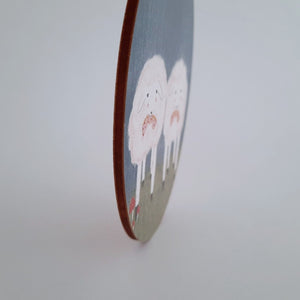 A close view of the edge of the wooden sheep ornament. Pic 5 of 6. 