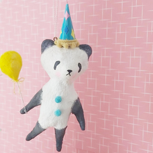 Cargar imagen en el visor de la galería, Spun cotton panda hanging from thread, in front of pink and white mid century wallpaper. Picture 6
