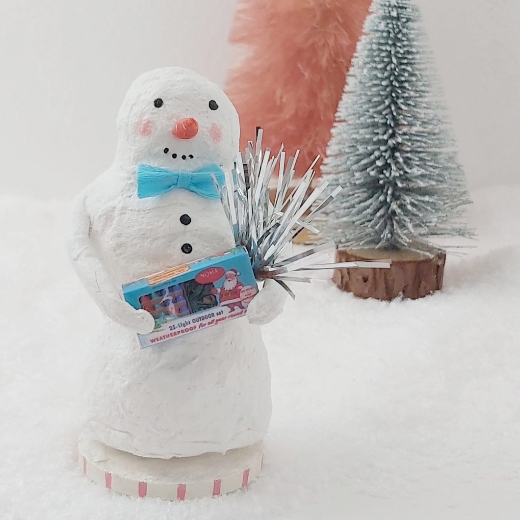 Spun Cotton snowman, carrying a Christmas lights box and tinsel. Photo 1 of 7