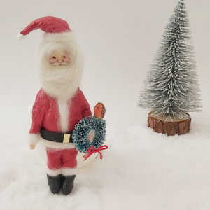 spun cotton Santa, holding wreath with robin sitting on top