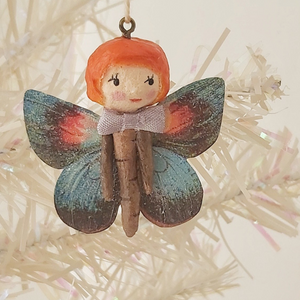Spun cotton butterfly girl, dangling from tree. Pic 1 of 8.