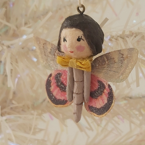 Close up side view of spun cotton butterfly girl. Pic 2 of 8.