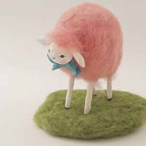 A side view of pink felted sheep, standing on felted green grass. Pic 2 of 6.