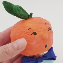 Cargar imagen en el visor de la galería, Close up of spun cotton orange boy ornament. Pic 3 of 6.
