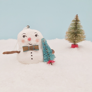 Close up of spun cotton snowman holding turquoise Christmas tree. Pic 5 of 7.