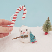 Cargar imagen en el visor de la galería, Spun cotton candy cane ornament, held in hand for size comparison, with spun cotton snowman sitting underneath. Pic 3 of 7.
