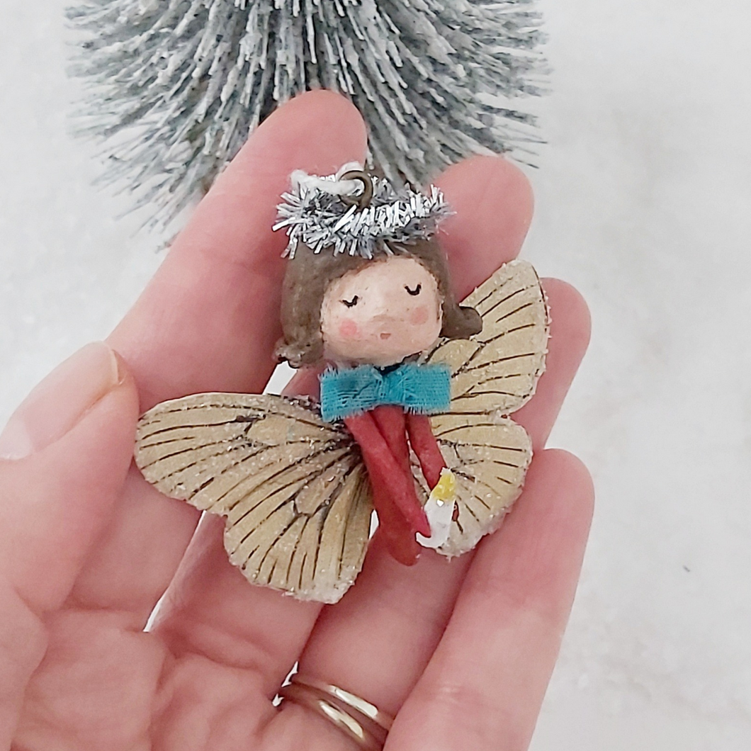 Spun cotton Christmas butterfly angel ornament, held in hand. Pic 1 of 6