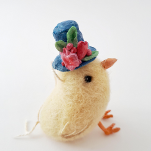 Close up photo of top hat flowers while felted chick is sitting (picture 4)