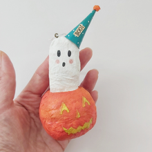 Load image into Gallery viewer, Spun cotton ghost in jack o&#39;lantern ornament, held in hand for size comparison. Pic 3 of 5.
