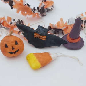 Spun cotton Halloween miniature ornaments, laying by Halloween garland.  Pic 4 of 6. 