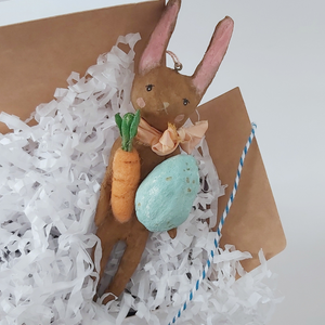 Spun cotton chocolate brown bunny in gift box with white shredded tissue paper. Pic 5 of 8.