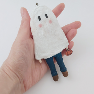 Spun cotton ghost boy ornament, held in hand for size comparison. Pic 2 of 6. 