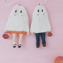 Load image into Gallery viewer, Spun cotton ghost boy and ghost girl ornaments, laying on pink background. Pic 6 of 6.
