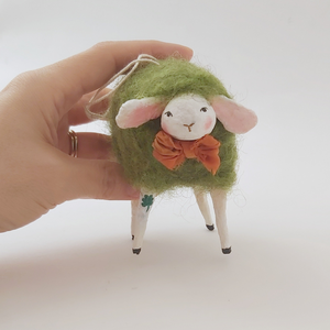 Spun cotton green sheep ornament, held in hand. Pic 2 of 6. 