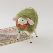 Load image into Gallery viewer, Spun cotton green wool sheep ornament, standing on vintage Ireland souvenir booklet. Pic 1 of 6. 
