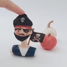 Cargar imagen en el visor de la galería, Spun cotton pirate boy ornament, sitting in front of spun cotton white and orange pumpkins. Pic 1 of 7. 
