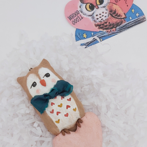 Spun cotton Valentine's Day owl, laying on white tissue paper shredding. Pic 6 of 6. 